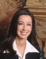 a woman smiling for a portrait